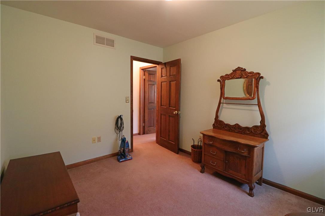 103 James Way Road Bath, PA 18014 - Photo 29 of 50 a room with gym equipment and a mirror