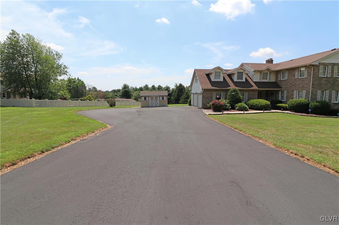 103 James Way Road Bath, PA 18014 - Photo 3 of 50 a front view of a house with a yard and garage