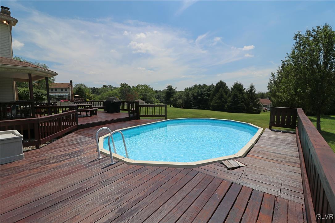 103 James Way Road Bath, PA 18014 - Photo 49 of 50 a view of a swimming pool with a patio and wooden floor