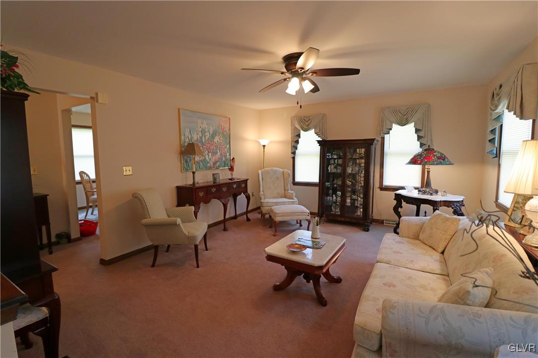 103 James Way Road Bath, PA 18014 - Photo 8 of 50 a living room with furniture a chandelier and a window