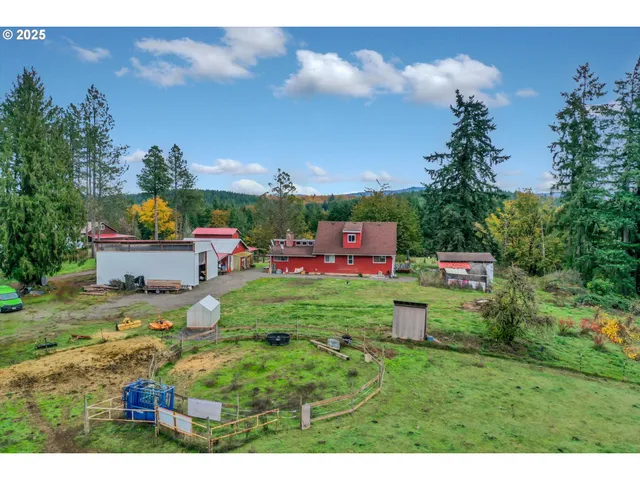 a backyard of a house with a garden and outdoor seating