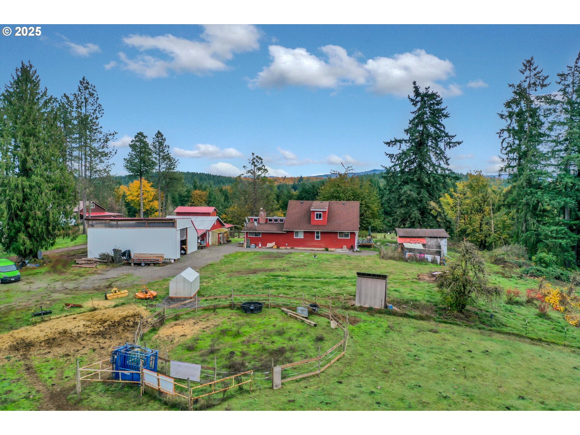 a backyard of a house with a garden and outdoor seating