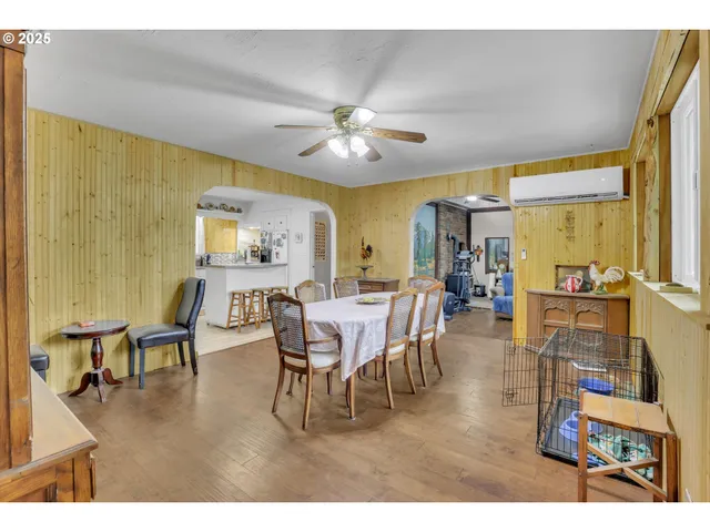 a view of a dining room with furniture and chandelier