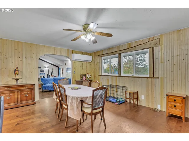 a dining room with furniture a window and a chandelier