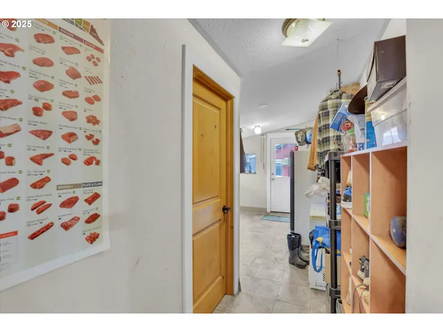 a view of a livingroom with furniture and a window