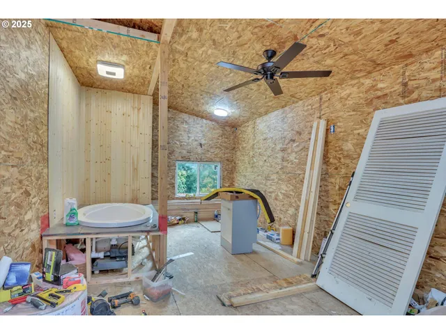 a picture of a wall with a white wall and a bed