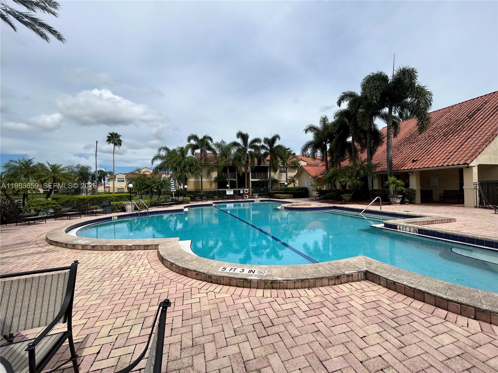 1263 Southwest 46th Avenue, Unit 2109 Pompano Beach, FL 33069 - Photo 12 of 18 a view of swimming pool having outdoor seating