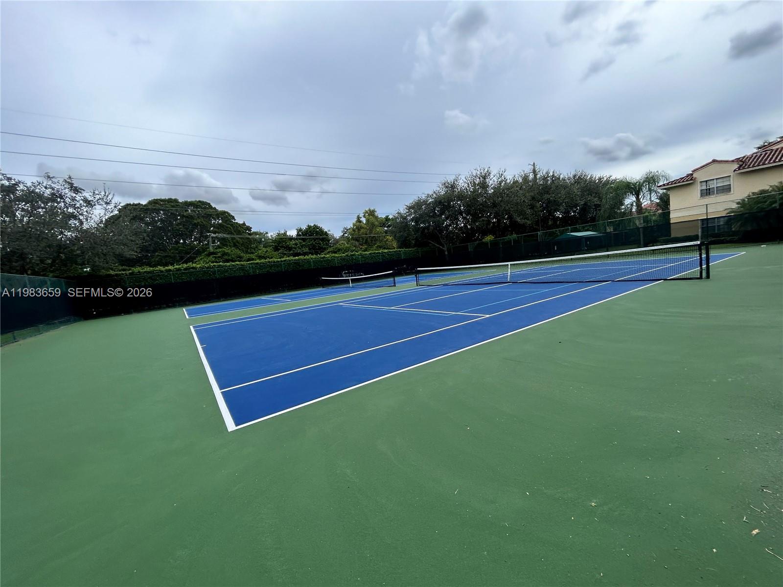 1263 Southwest 46th Avenue, Unit 2109 Pompano Beach, FL 33069 - Photo 14 of 18 a view of a tennis court