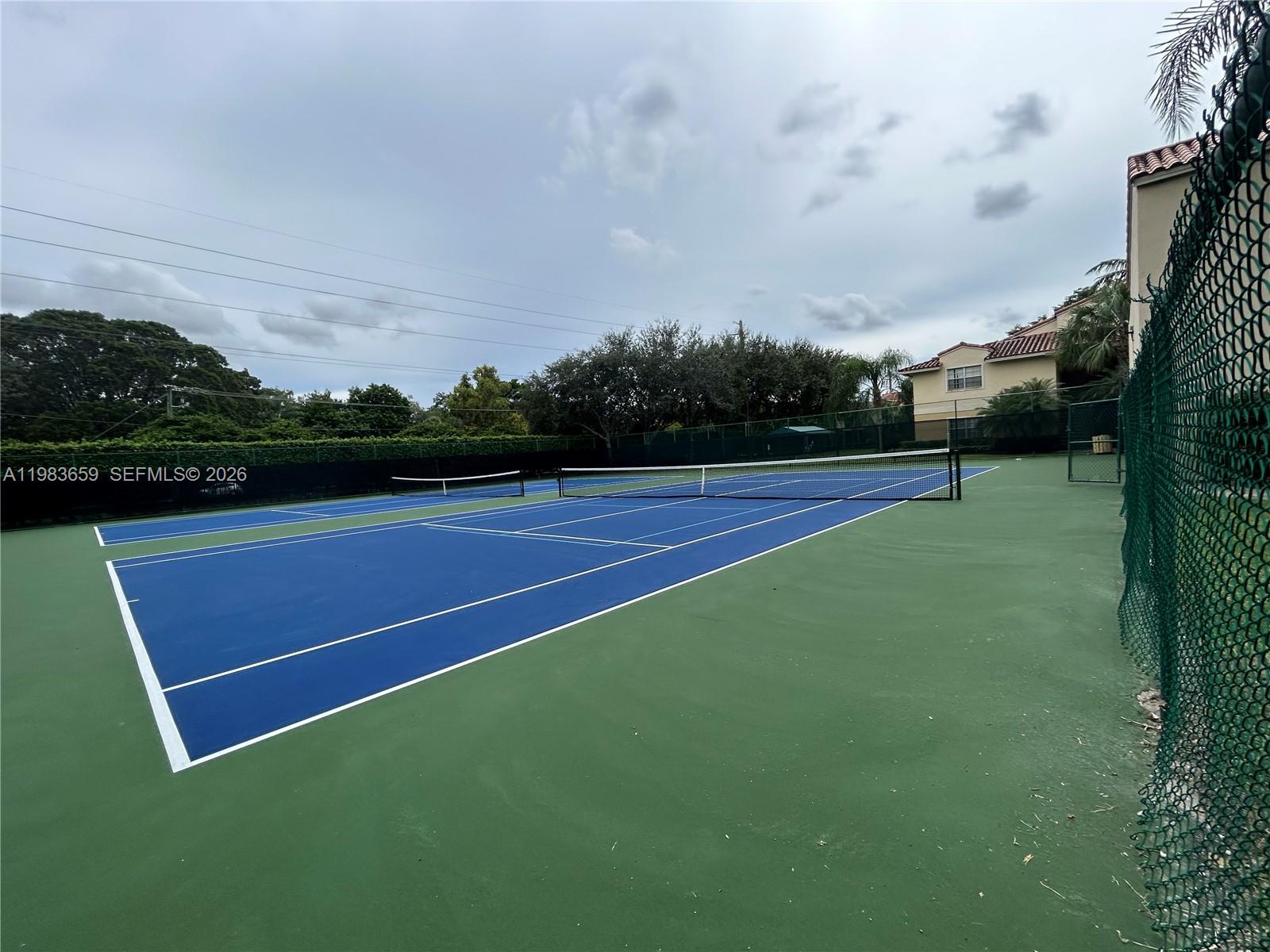 1263 Southwest 46th Avenue, Unit 2109 Pompano Beach, FL 33069 - Photo 15 of 18 a view of an outdoor space and tennis court