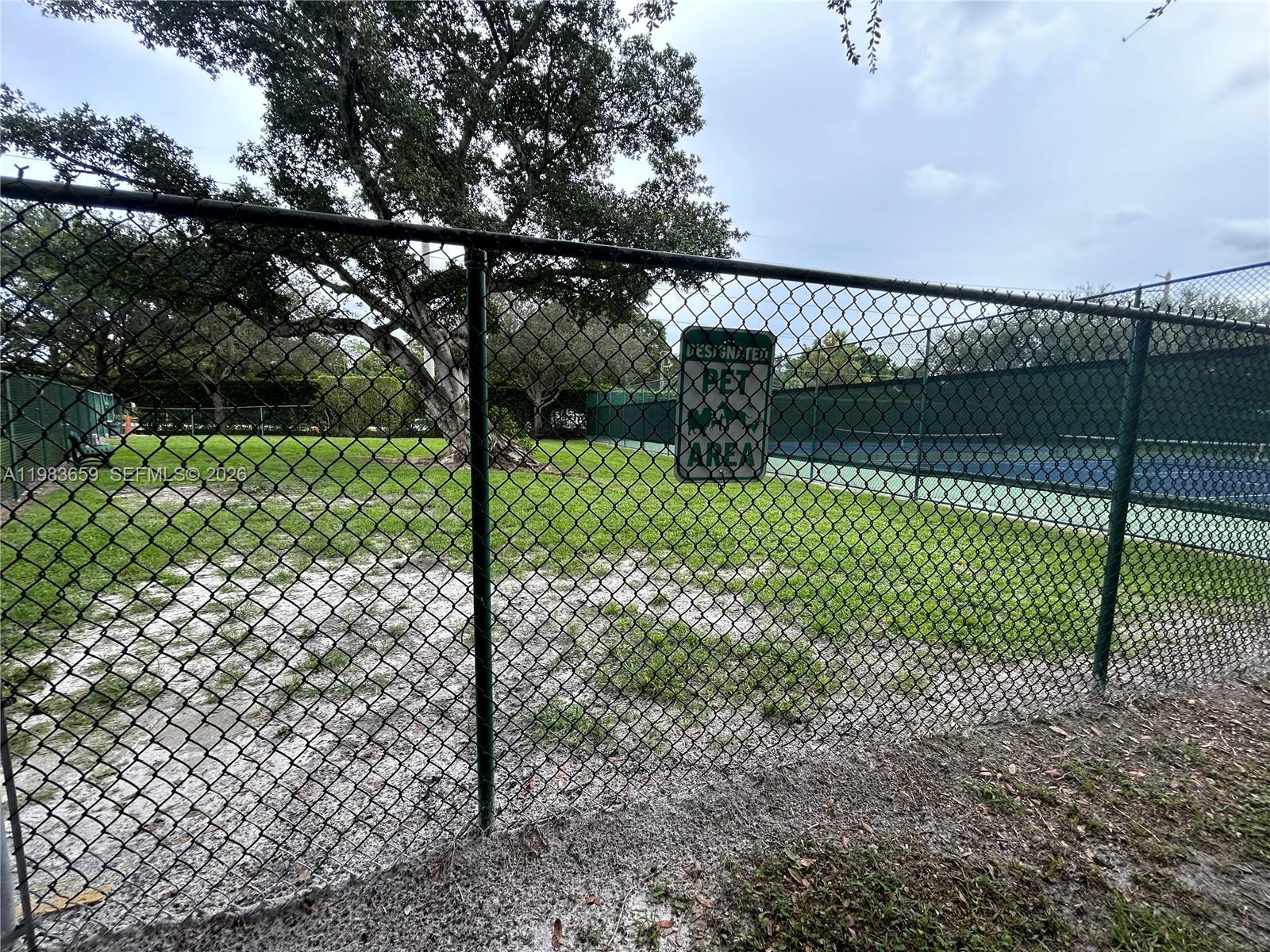 1263 Southwest 46th Avenue, Unit 2109 Pompano Beach, FL 33069 - Photo 16 of 18 a view of a backyard