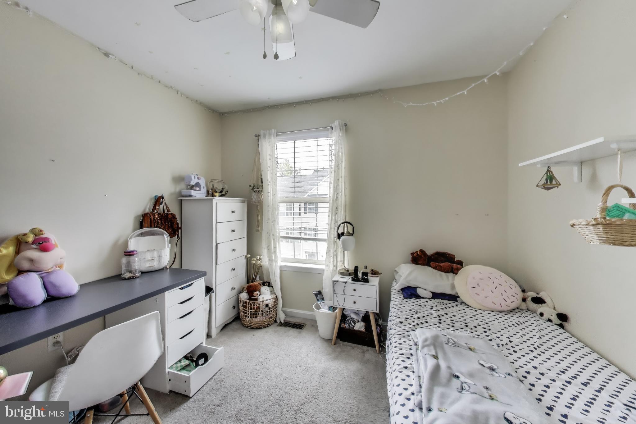 839 Patuxent Run Circle Odenton, MD 21113 - Photo 12 of 28 a bedroom with a bed and a window
