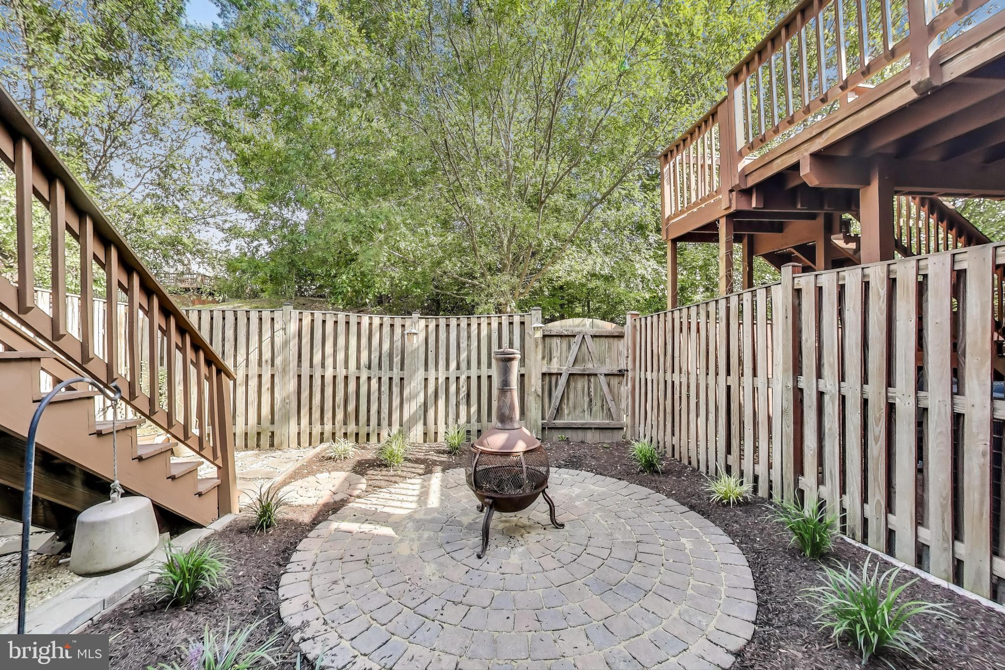 839 Patuxent Run Circle Odenton, MD 21113 - Photo 22 of 28 a balcony with wooden floor potted plants and wooden fence