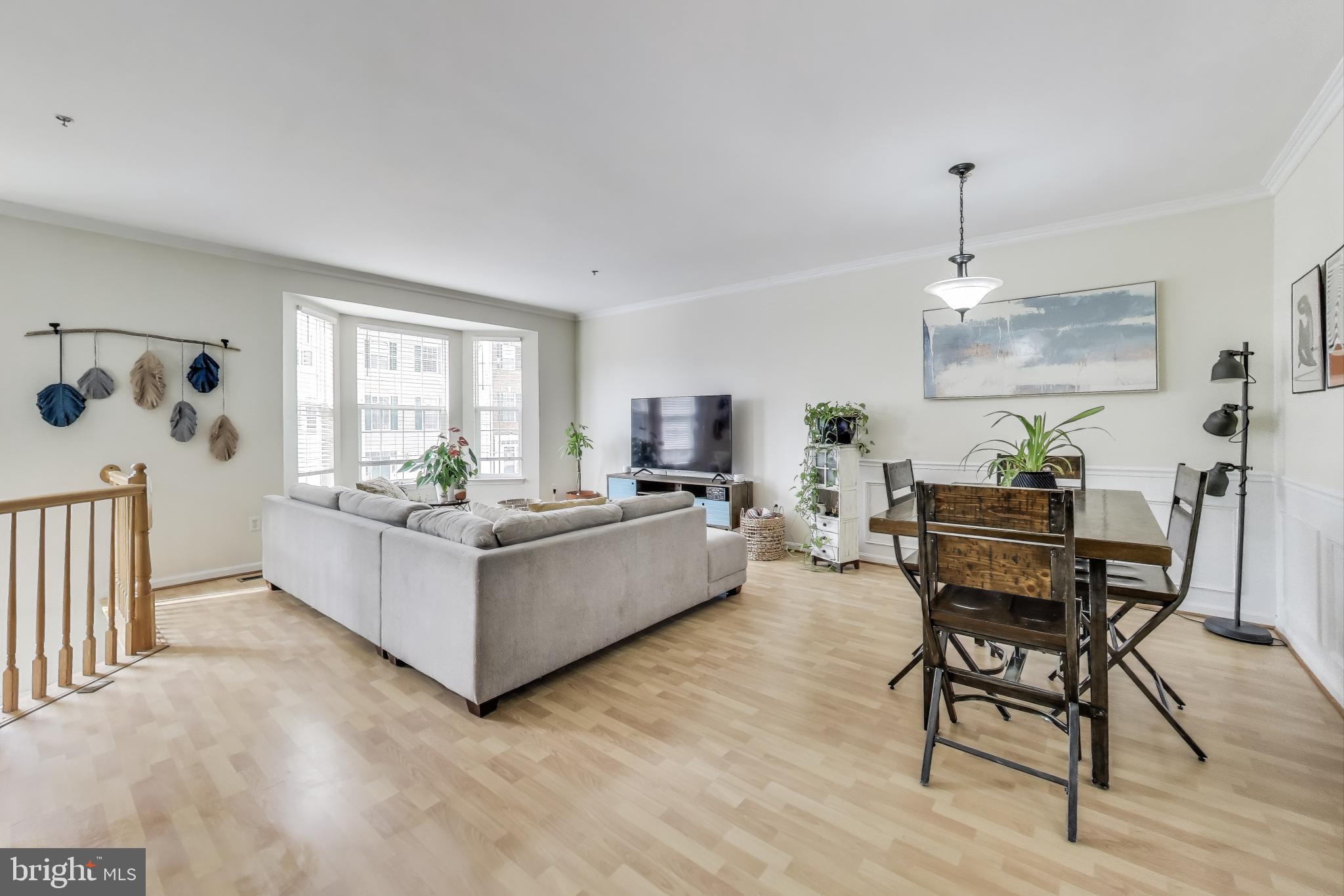 839 Patuxent Run Circle Odenton, MD 21113 - Photo 3 of 28 a living room with furniture and a wooden floor