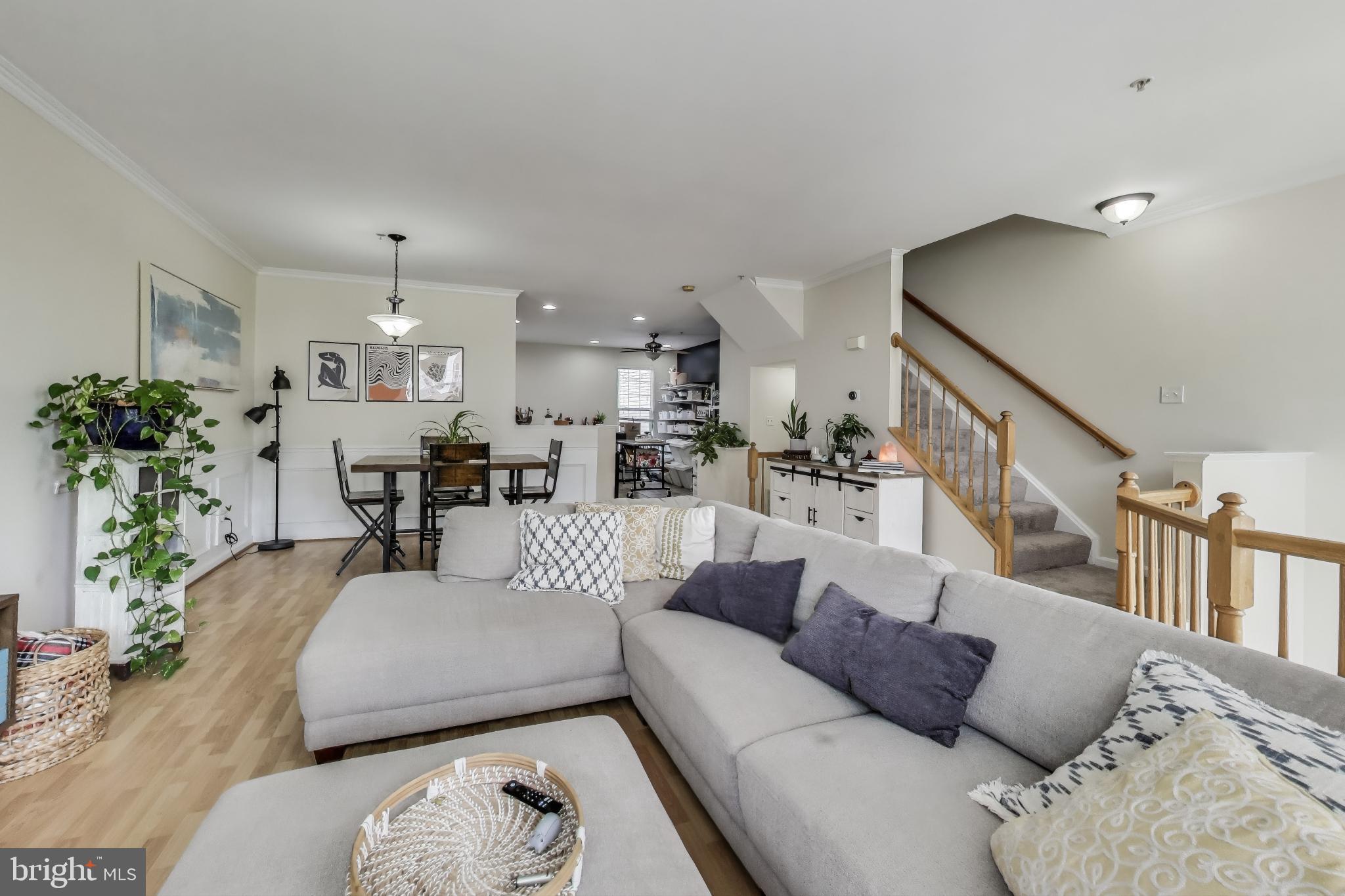 839 Patuxent Run Circle Odenton, MD 21113 - Photo 4 of 28 a living room with furniture and a chandelier