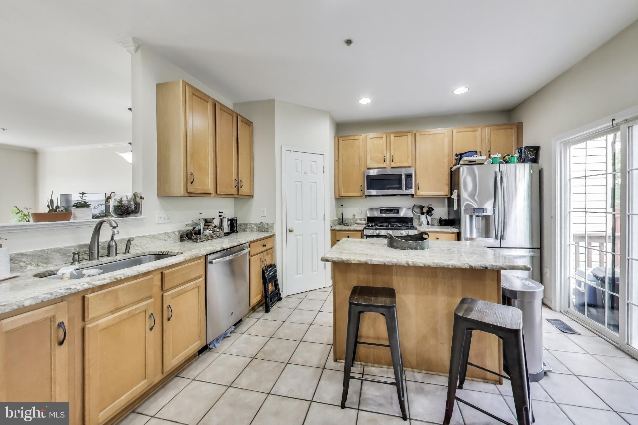 839 Patuxent Run Circle Odenton, MD 21113 - Photo 5 of 28 a kitchen with appliances cabinets and a sink