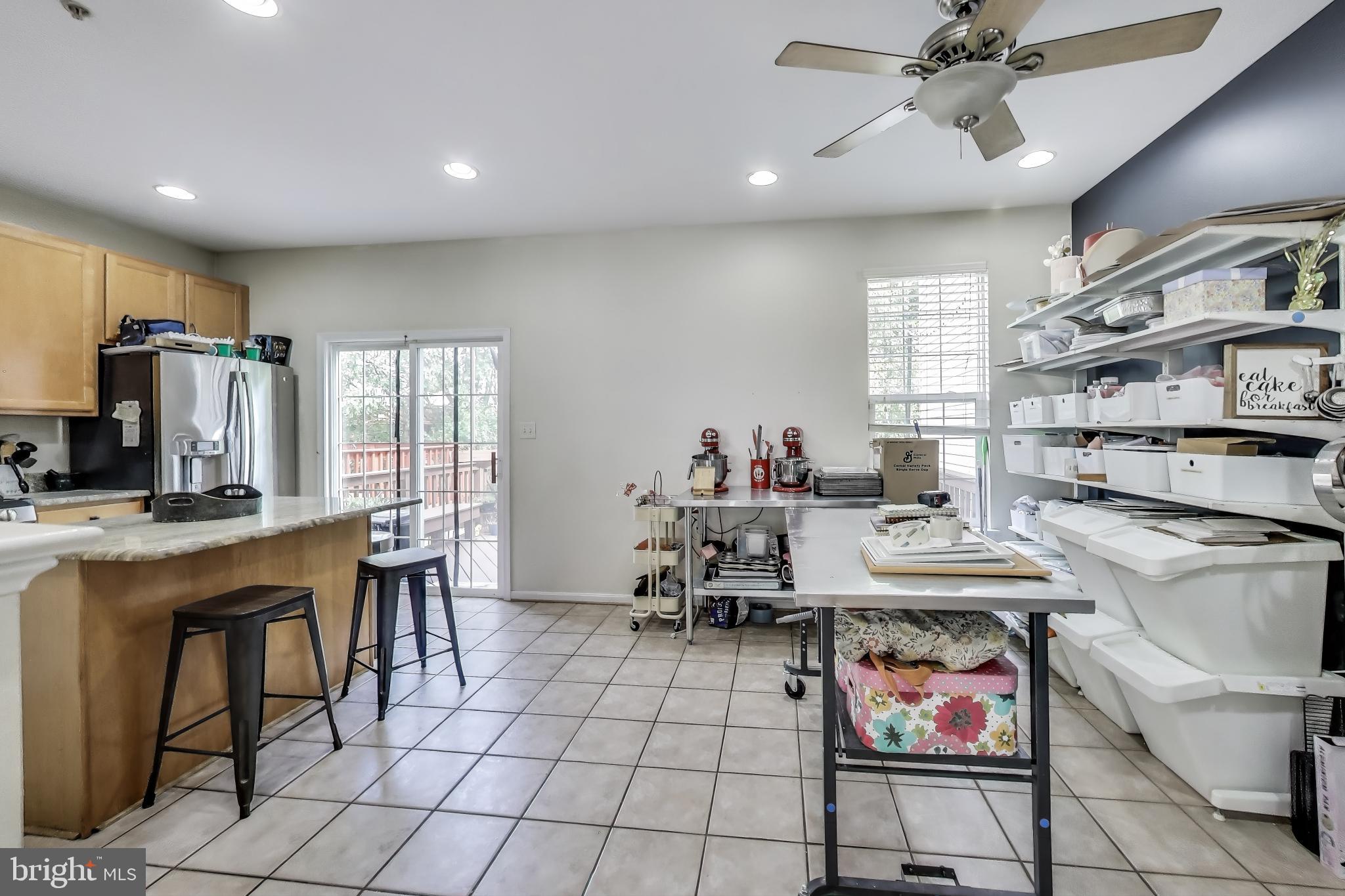 839 Patuxent Run Circle Odenton, MD 21113 - Photo 7 of 28 a view of a dining room with furniture and a kitchen