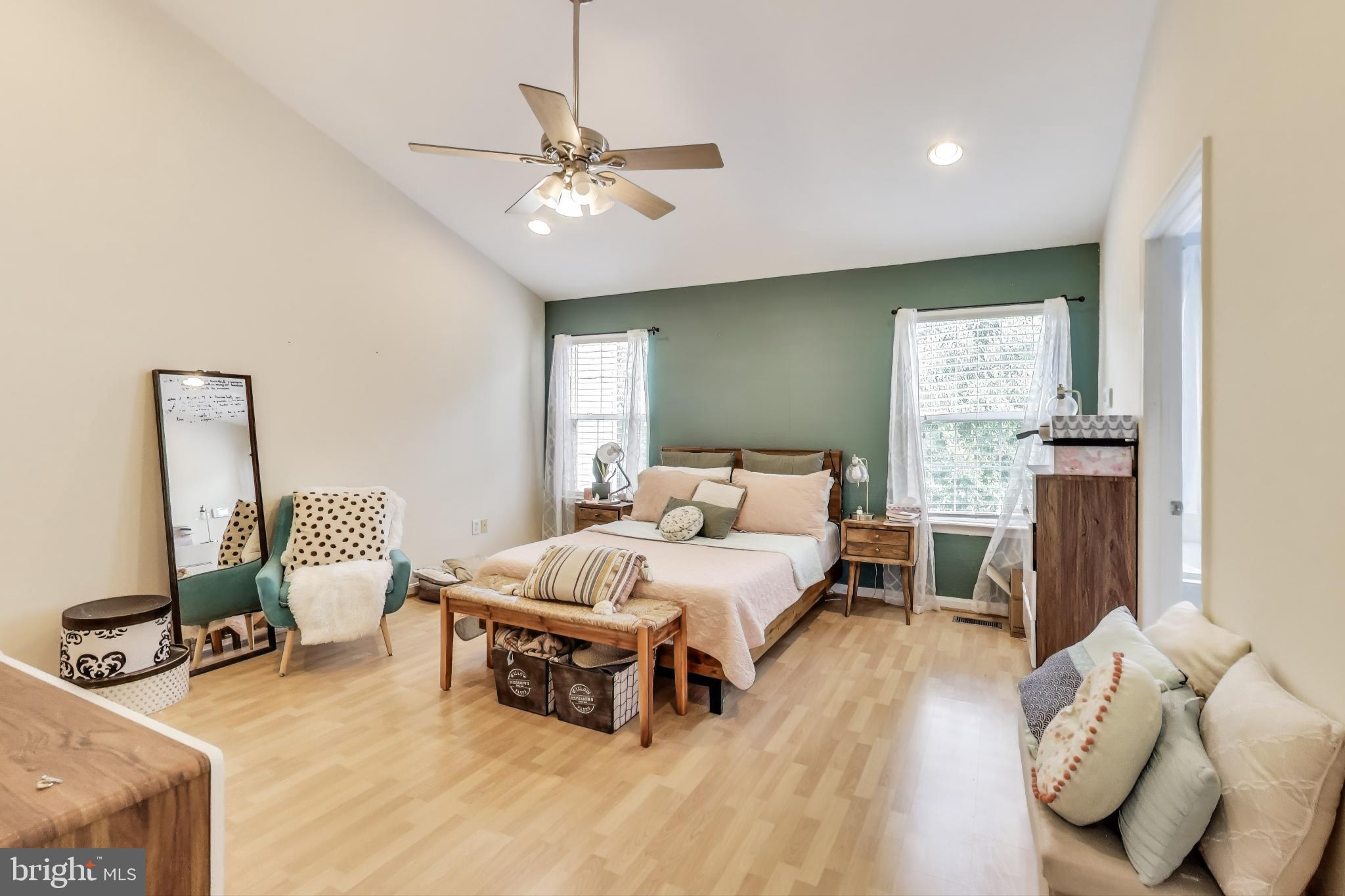839 Patuxent Run Circle Odenton, MD 21113 - Photo 8 of 28 a bedroom with furniture and a chandelier