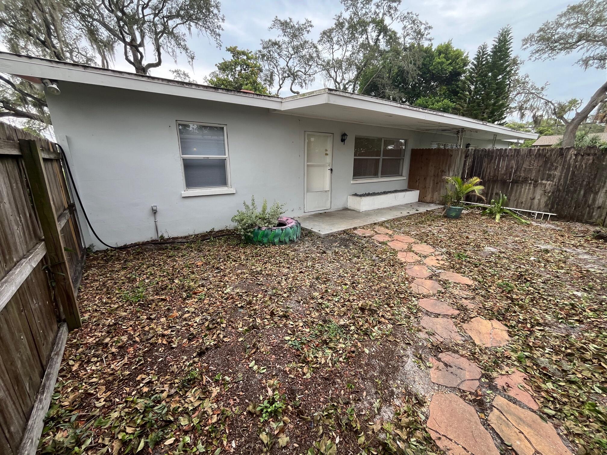 1815 Guava Avenue Melbourne, FL 32935 - Photo 1 of 1 a house with trees in the background