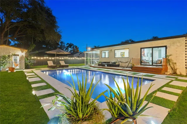 a view of swimming pool with outdoor seating