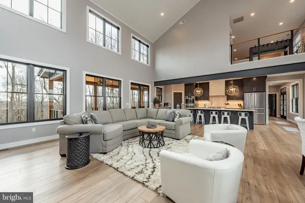 a kitchen with kitchen island a sink appliances and cabinets