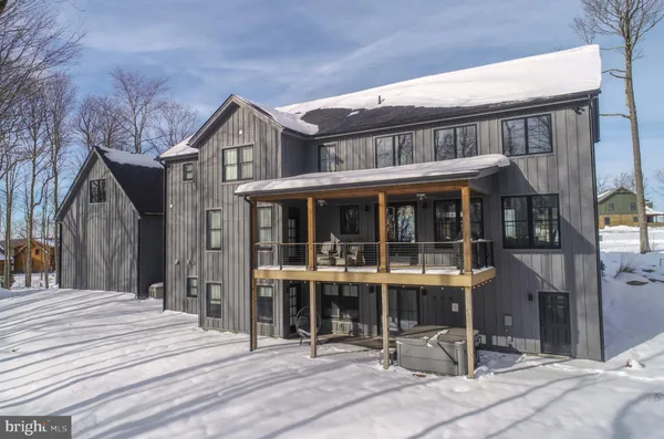 a spacious bathroom with a tub and window