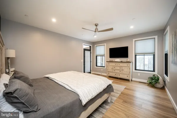 a en suite bathroom with a granite countertop sink