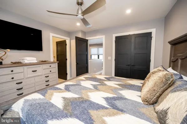 a room with lots of furniture and windows