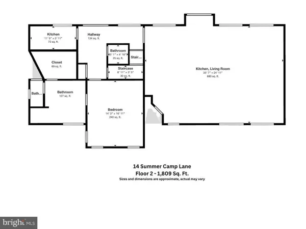 a large kitchen with kitchen island a large island in the center windows and furniture