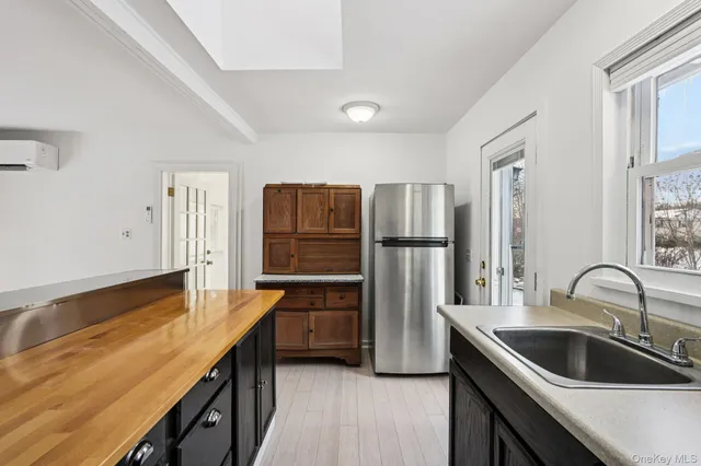 a kitchen with refrigerator cabinets and stainless steel appliances