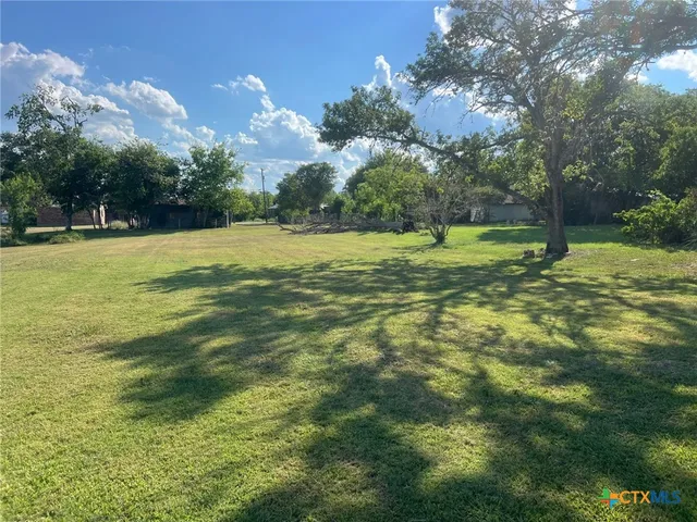 a view of a golf course with a lake