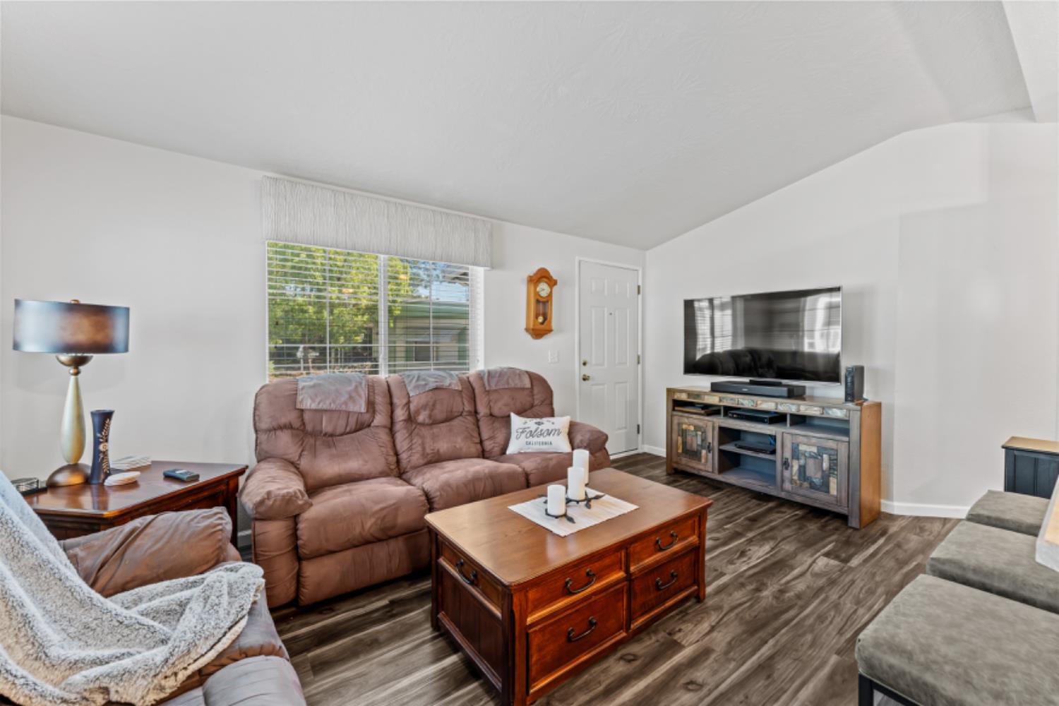 96 Monterey Lane Folsom, CA 95630 - Photo 7 of 27 a living room with furniture a flat screen tv and a window