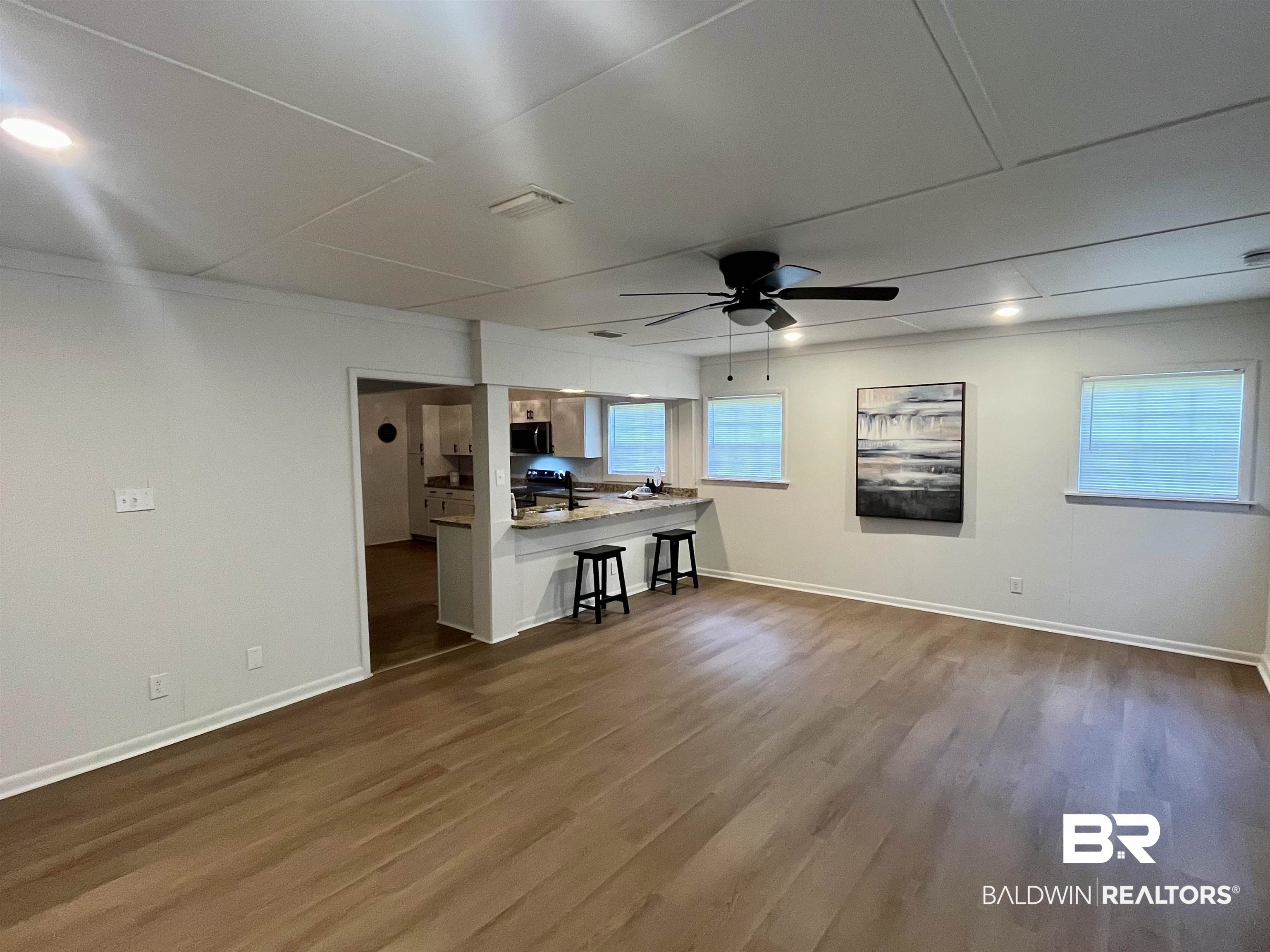 3105 Bryant Road Mobile, AL 36605 - Photo 20 of 39 Expansive living area featuring wood-finish flooring, recessed lighting, and a ceiling fan