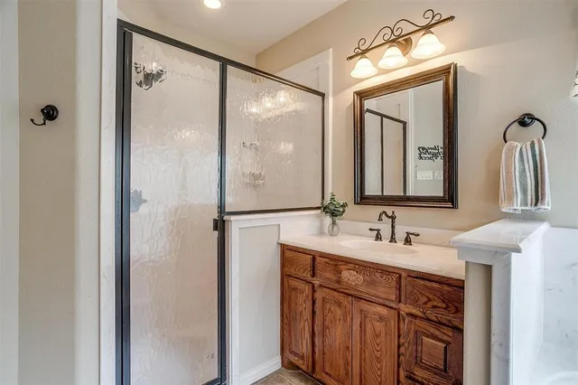 a bathroom with a double vanity sink and a mirror