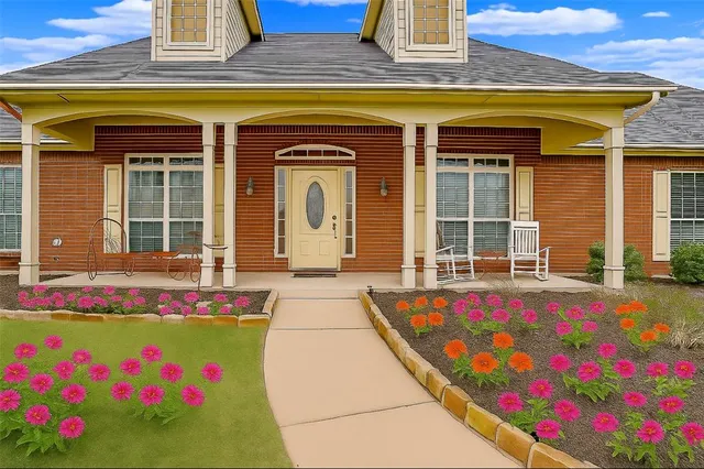 a front view of house with an outdoor space