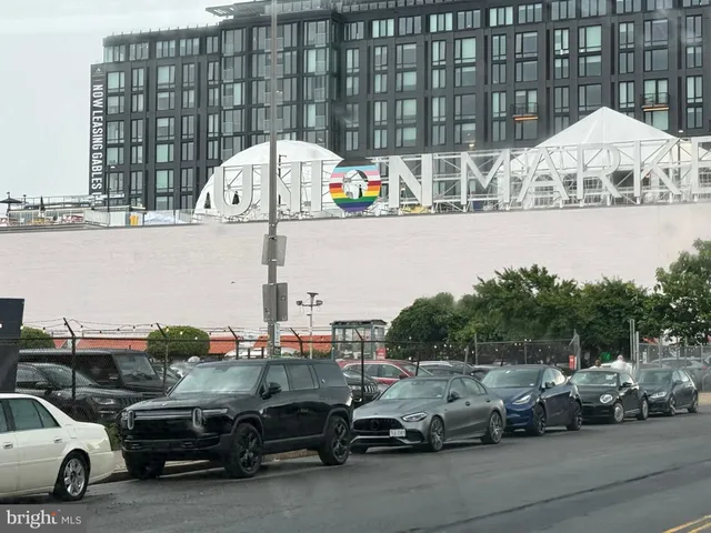 a view of parking with cars and parked cars