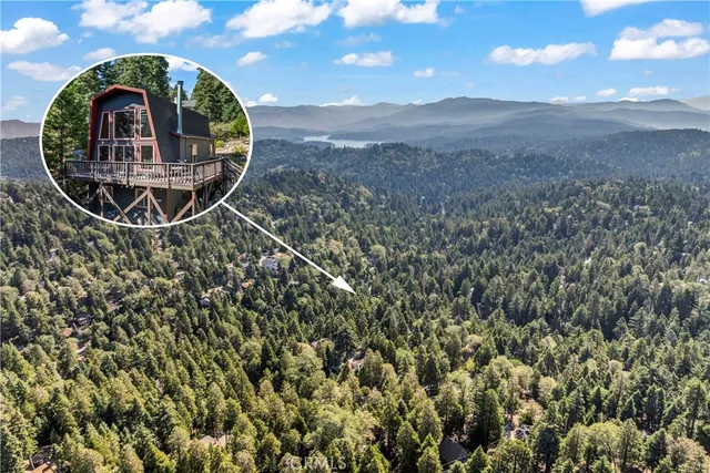 a view of a living room with furniture and a floor to ceiling window