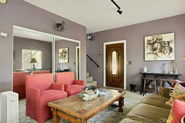 a view of a wooden balcony and trees