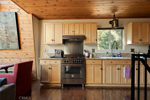 a view of a balcony with wooden floor and outdoor seating