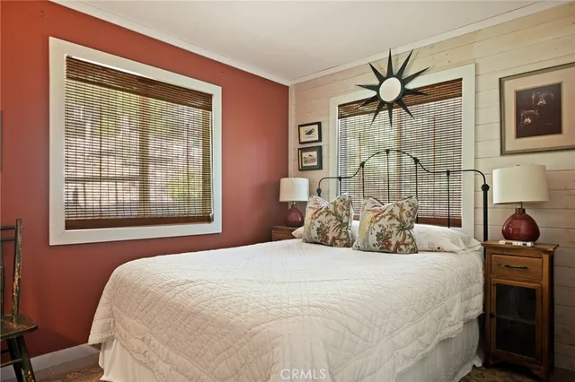 a bedroom with a bed and a table with chair