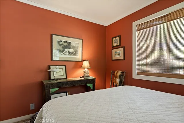 a view of a bedroom with washer and dryer