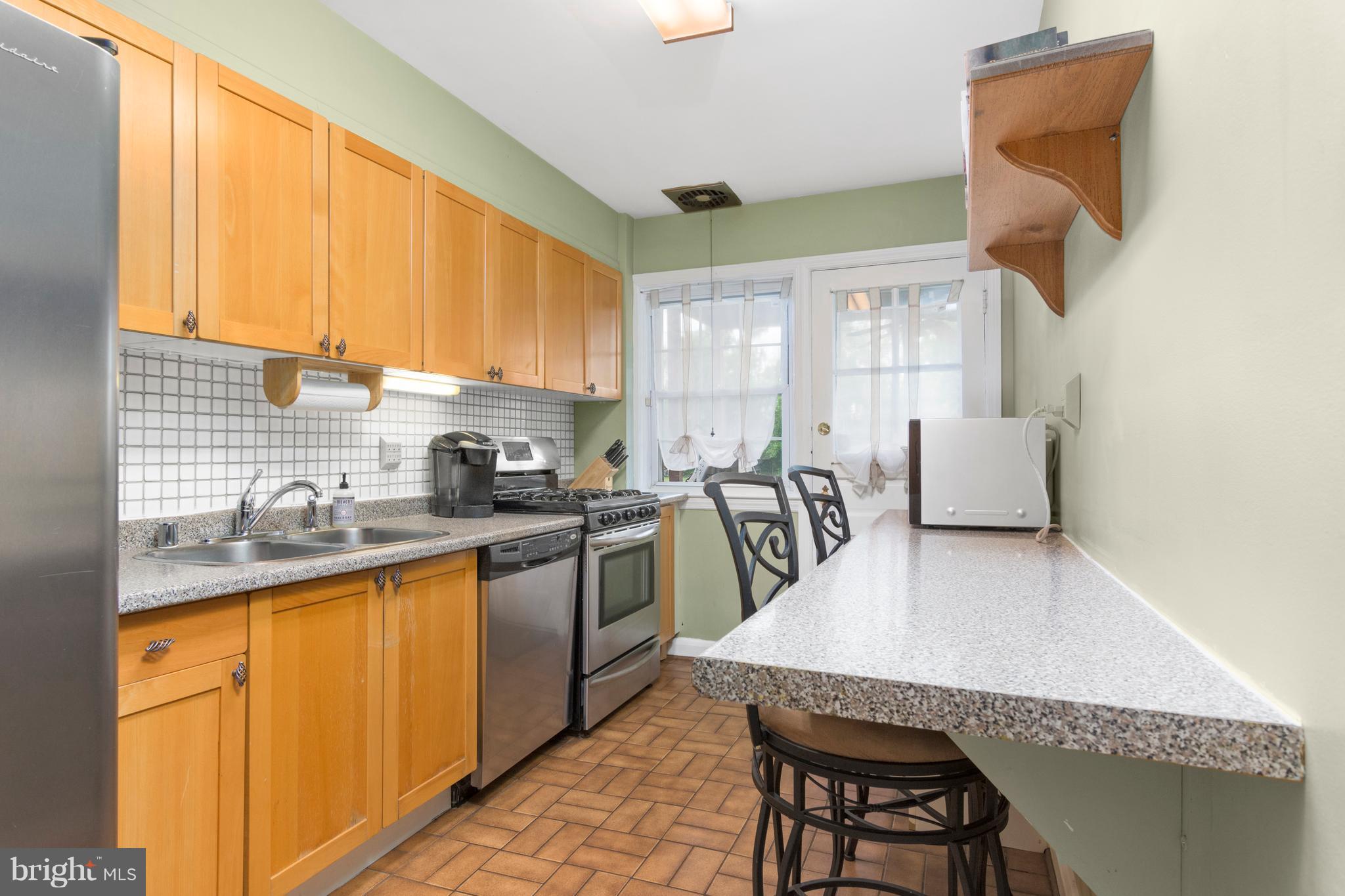 426 Academy Road Baltimore, MD 21228 - Photo 6 of 30 Kitchen has Maple cabinets, stainless appliances