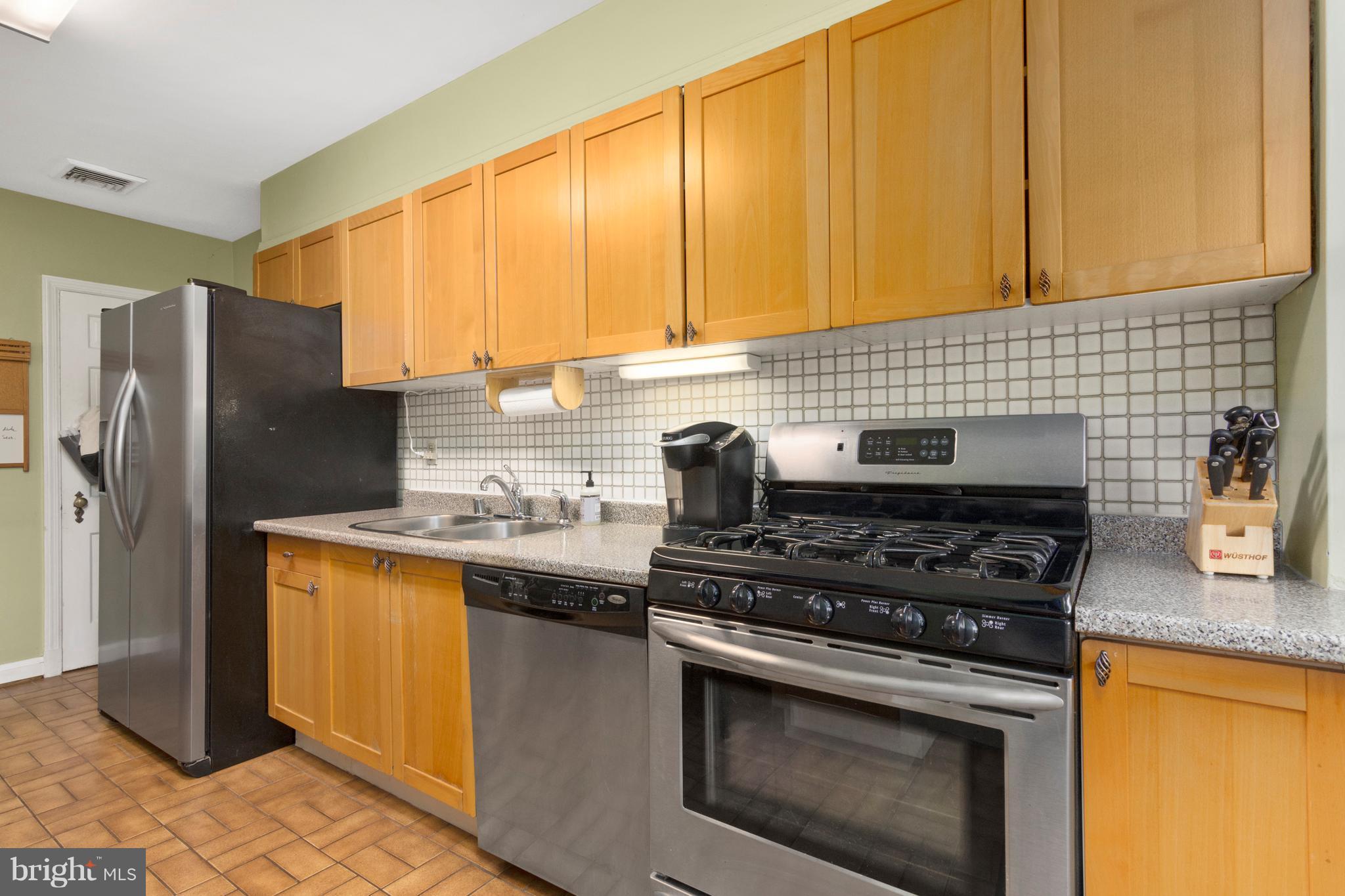 426 Academy Road Baltimore, MD 21228 - Photo 7 of 30 Kitchen with breakfast bar and opens to the deck