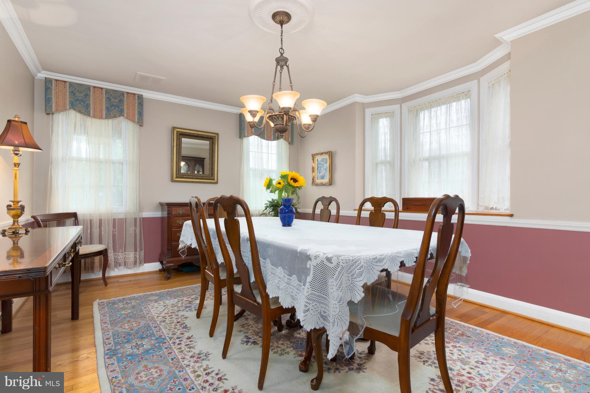 426 Academy Road Baltimore, MD 21228 - Photo 9 of 30 Dining Room with chair rail and extra bay window
