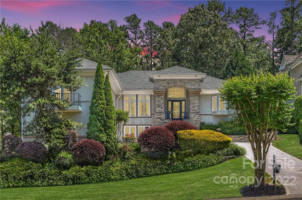 18626 River Crossing Boulevard Davidson, NC 28036 - Photo 1 of 1 a front view of a house with a yard garden and outdoor seating