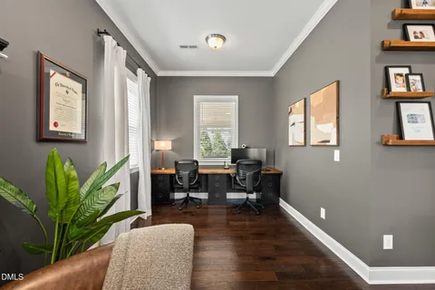 a spacious bedroom with a bed next to a large window with the outer view