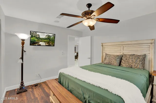 a bedroom with a large bed and a window