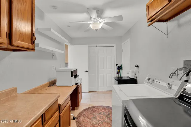 a kitchen with a stove and a refrigerator