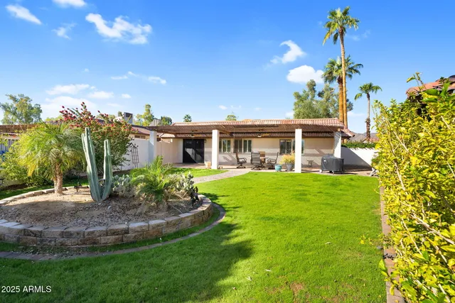 a room with a bed and a chandelier
