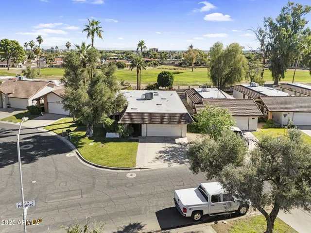 a view of a house with basketball court
