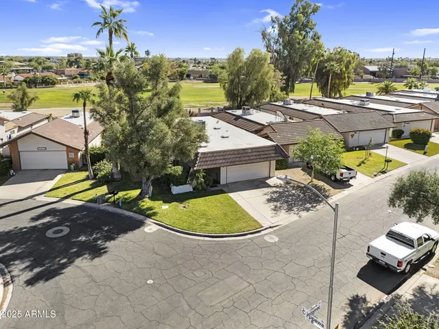 an aerial view of a house with a garden